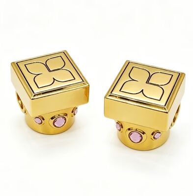 Buy Zinc Alloy Gold Plated Perfume Cap with Pink Crystal Accents, Clover Engraved Square Top online manufacture